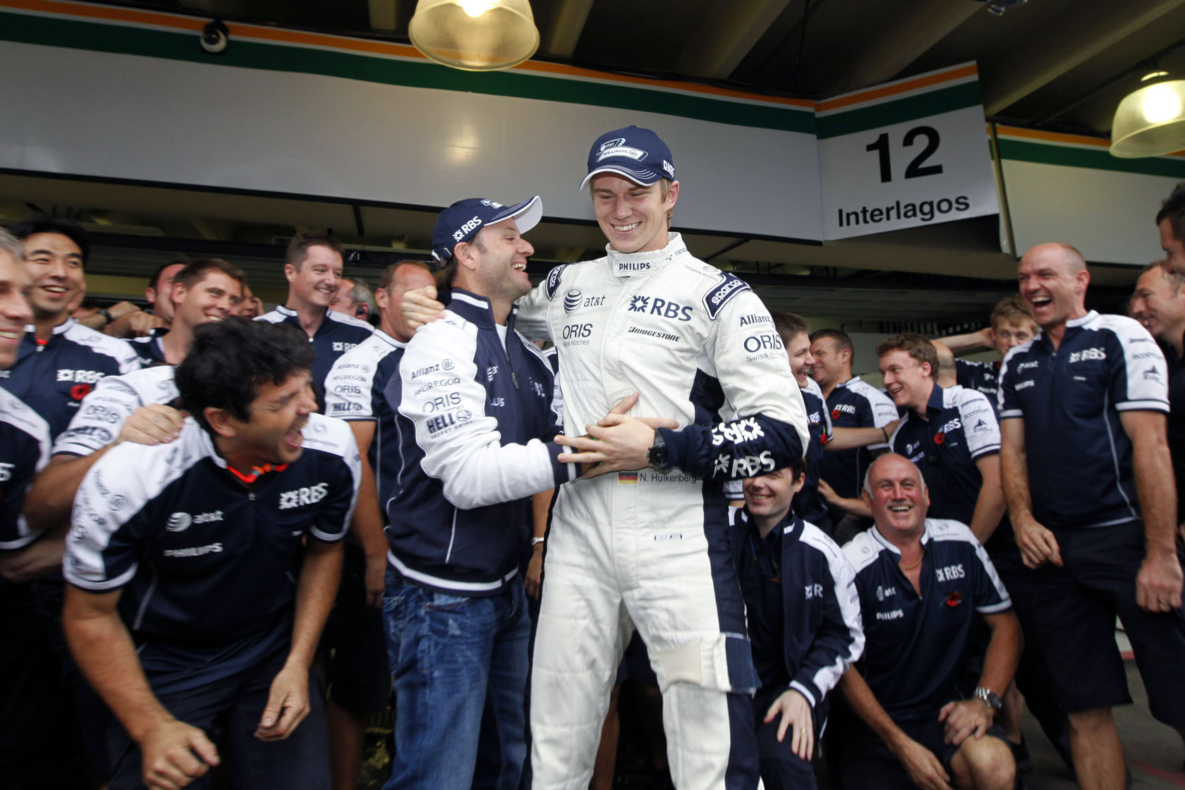 Brazilian Grand Prix - Saturday Interlagos, Sao Paulo, Brazil. 6th November 2010. Rubens Barrichello, Williams FW32 Cosworth. Congratulates Nico Hulkenberg, Williams FW32 Cosworth, after his pole position lap. Portrait.  Photo: Glenn Dunbar/LAT Photographic ref: Digital Image GD5D1383